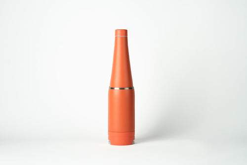Duet water bottle with a coffee cup stored on the base. Coral-coloured product shown on a white background.