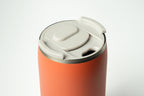 Coral Duet coffee cup with a light grey lid on a white background.