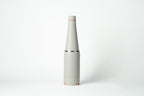 Light grey Duet water bottle with coffee cup stored on the base, shown on a white background.