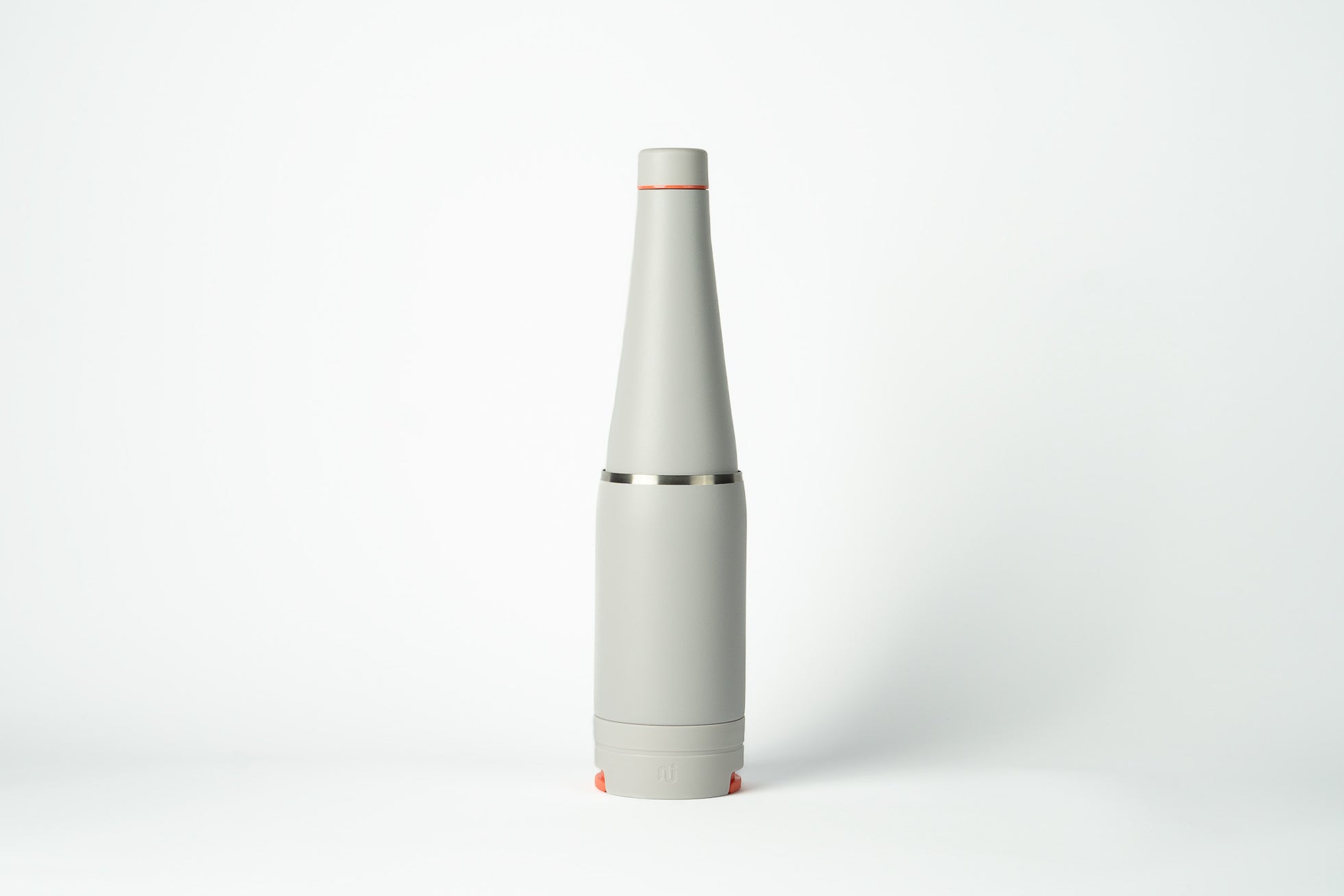 Light grey Duet water bottle with coffee cup stored on the base, shown on a white background.