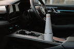 Fully assembled grey Duet coffee cup and water bottle system positioned in a car cup holder.